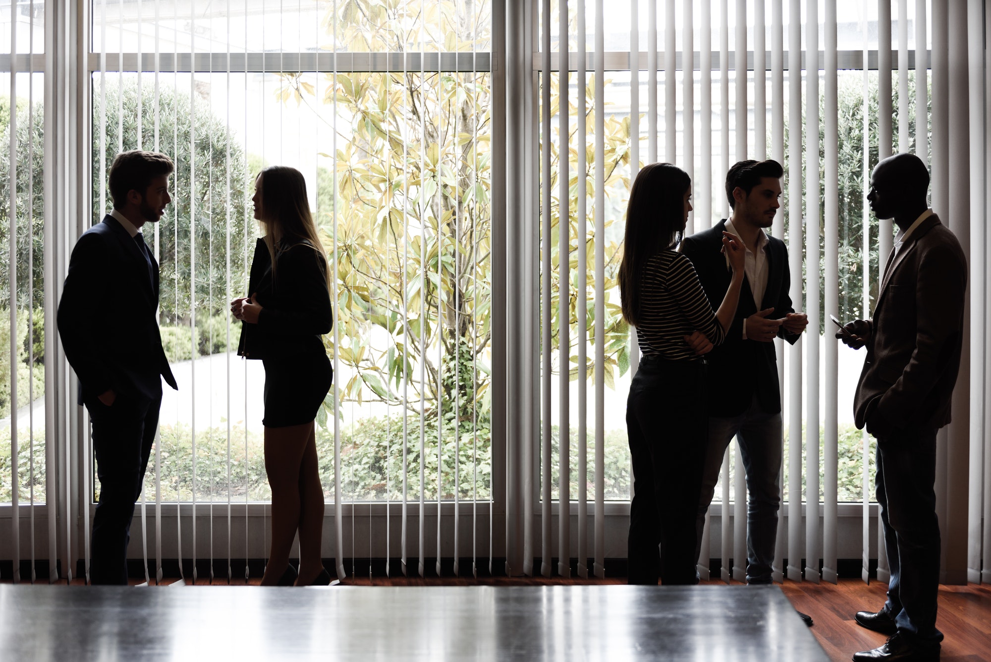 Silhouettes of businesspeople interacting background business ce