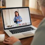 Senior woman in video tele medicine call with doctor