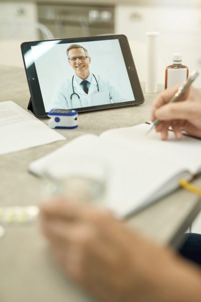 Modern doctors providing online consultations for patients at home